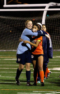 Freshman goalkeeper Anna brown and sophomore defender Megan Gomez hug each other after being eliminated from the playoffs on Nov. 30.