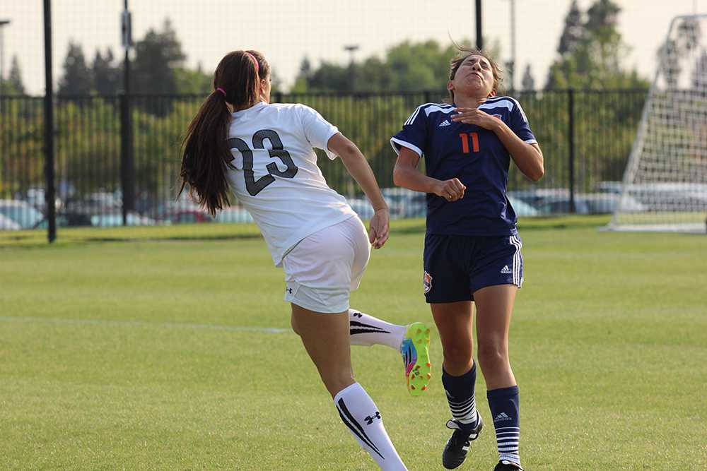 Rams freshman forward Kambria Morrison kicks the ball into the face of Hawks sophomore forward Selina Barbosa during the second half of the teams match on Sept. 9.