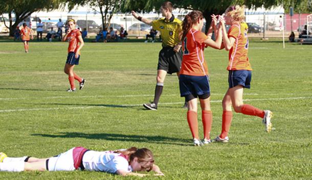 Freshman forwards Ashley Drake and Kristen Mickey celebrate after Torres' goal to put the hawks up by six goals near the end of the first half. 