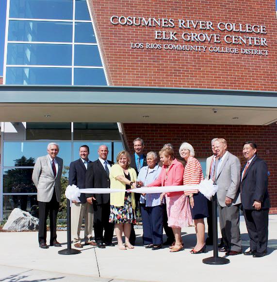 Surrounded by officials from the Los Rios Community College District and the city of Elk Grove, LRCCD Board of Trustees member Pamela Haynes cuts the ceremonial ribbon at Cosumnes River Colleges new Elk Grove Center on Sept. 13.