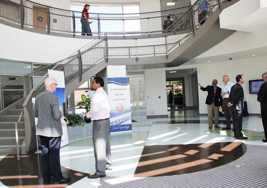 Faculty, Board of Trustee members, and various guests tour the newly opened Winn Center for Architecture and Construction after its official dedication on Aug. 23.