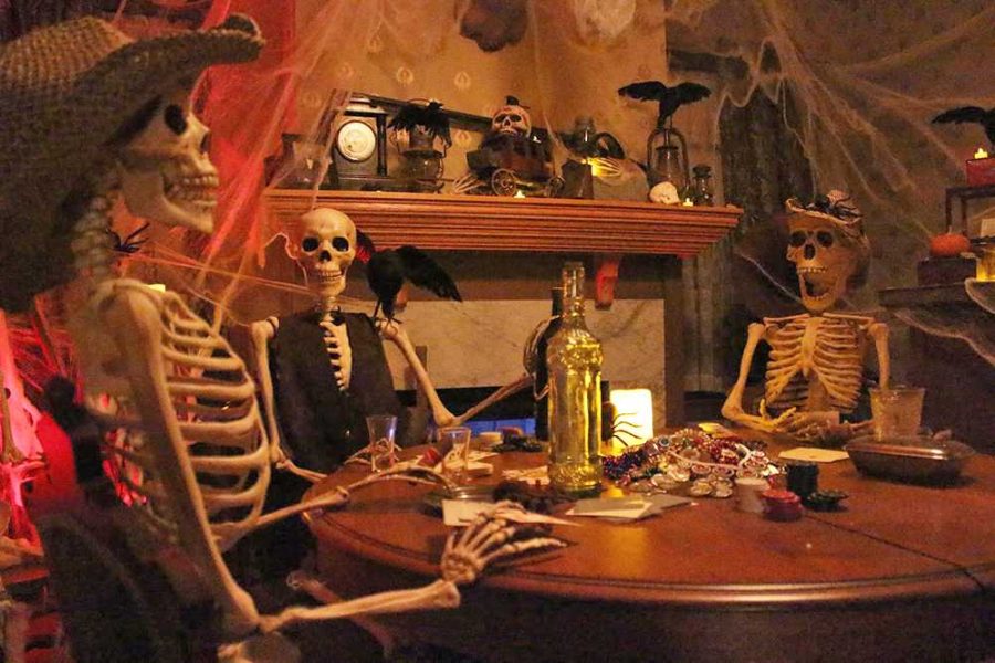 Prop skeletons sit around a table in a hauntingly decorated room at the Elk Grove Historical Societys new haunted house. This October marks the Historical Societys first invitation to their haunted experience. 