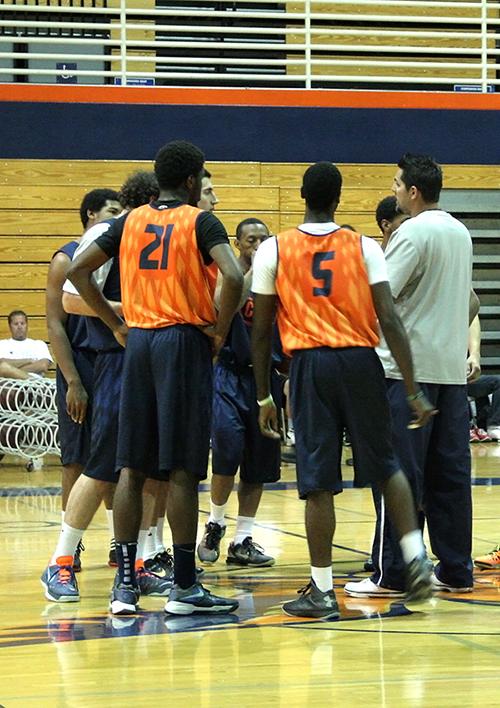 The+team+gathers+around+Cosumnes+head+coach+James+Giacomazzi+during+practice+on+Oct.+24.+