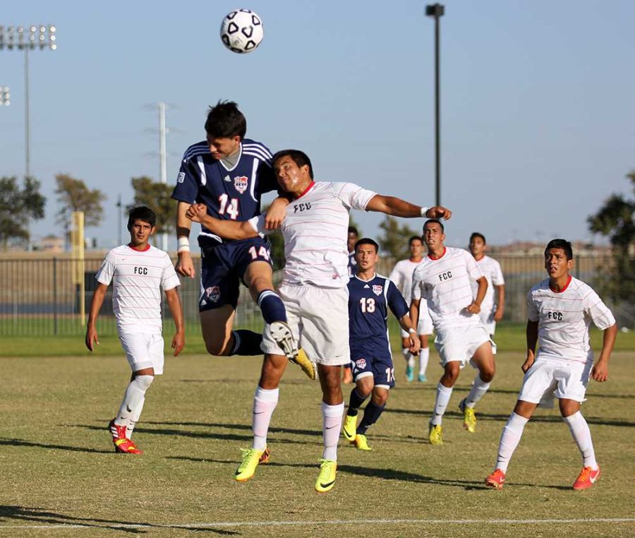 Freshman+midfielder+Jose+Torres+goes+up+for+a+contested+header+on+Oct.+15.