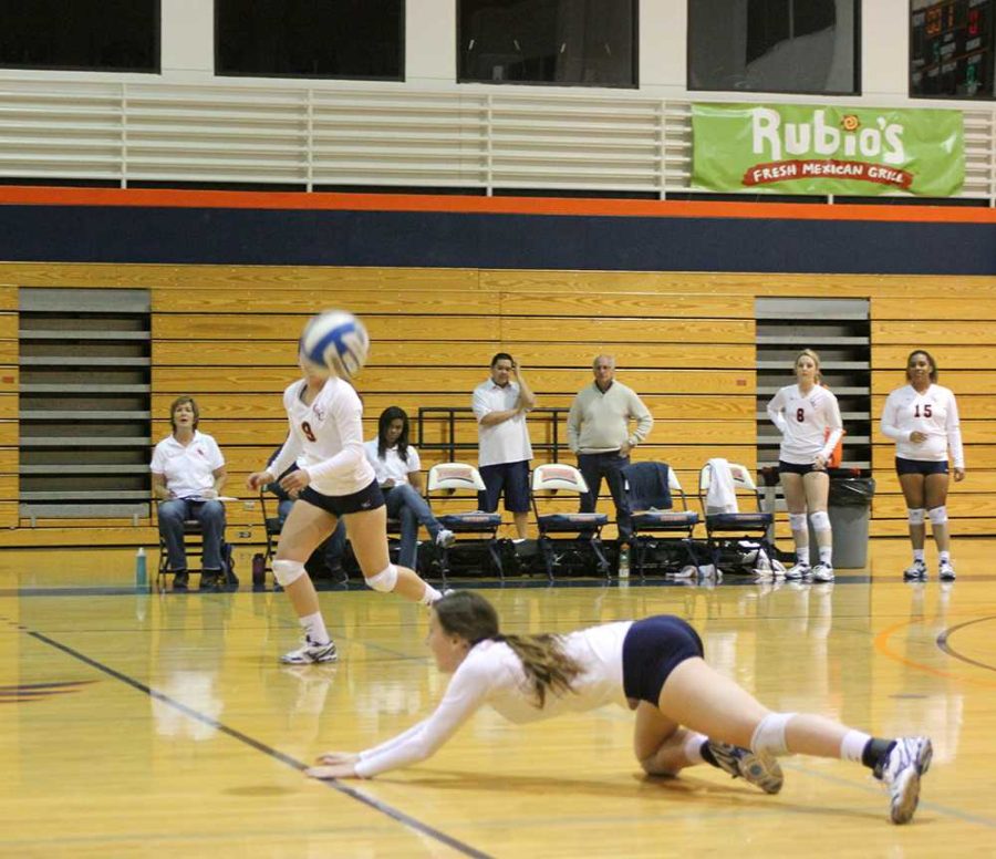 Sophomore outside hitter Gabrielle Hinz dives and saves a ball from hitting the floor on Nov. 6.