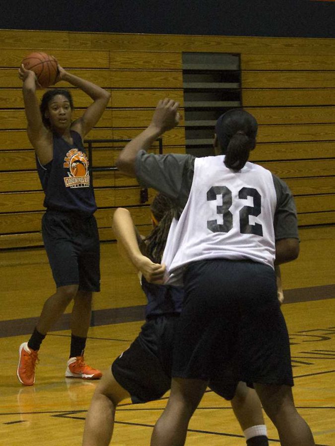 Cosumnes River College Hawks' basketball freshman forward Empres Barner looks to deliver a pass in practice on Dec. 3. After five years away from the sport, Barner has returned to the court after seeking out team head coach Coral Sage. 