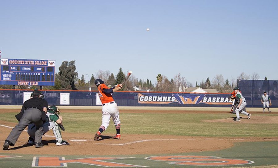 Sophomore center fielder Cody Morris hits the ball deep into center field, bouncing off the back wall, early in the second inning against the Shasta Knights on Feb. 1.