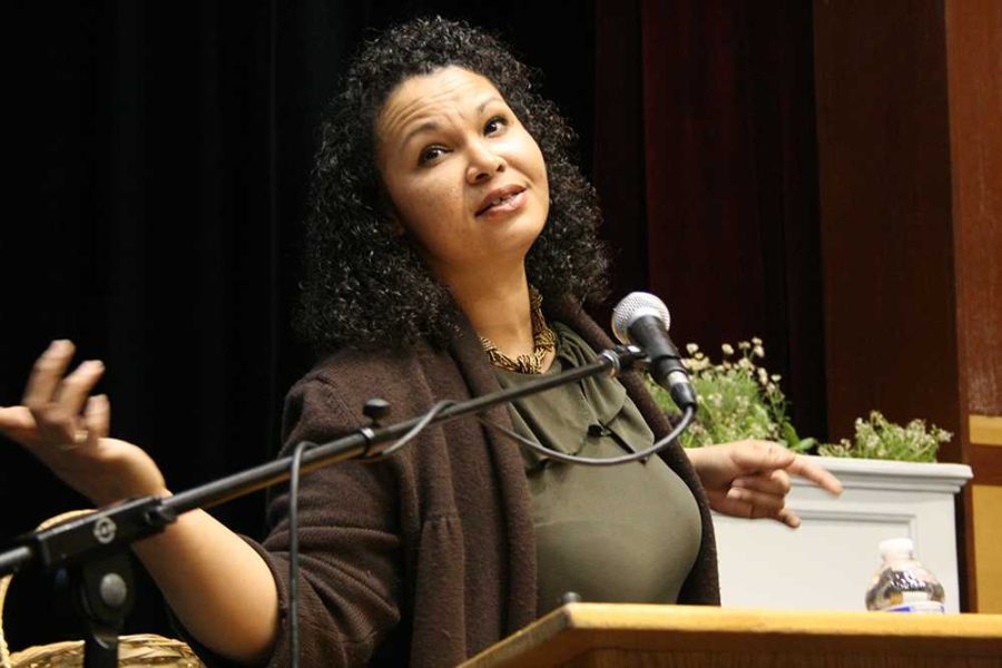 Poetic performer Anna Marie Sprowl shows her feelings through her gestures as she reads some of her poetry to Cosumnes River College students and faculty at the Black History Month Poetic Voices event. Sprowl was one of three performers to come share her works with students and faculty on Feb. 19.