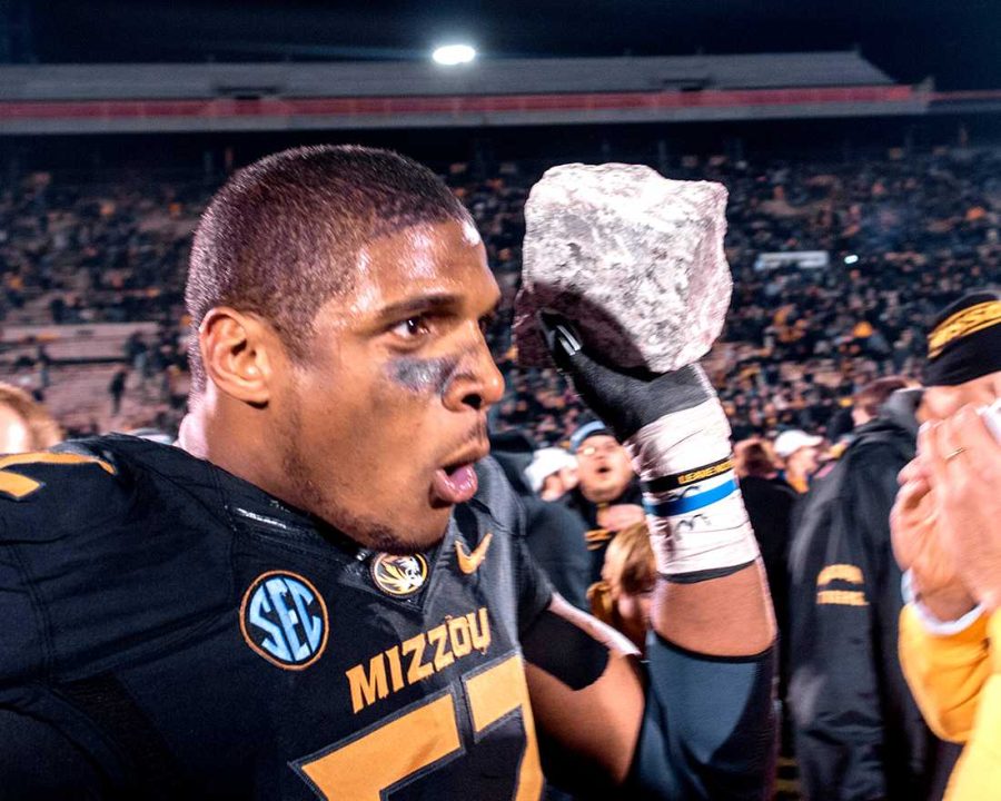 Michael Sam celebrating after a team victory.