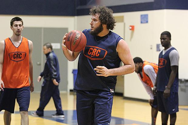 Hawks' sophomore center Jaycob Velasco stands amongst the rest of the men's basketball team in practice on March 4. The Hawks would lose to Fresno in the playoffs the following day.