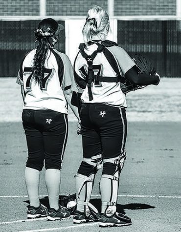 Freshman pitcher Amanda Horbasch and freshman catcher Carly Hintz stand together before their doubleheader on Feb. 1.