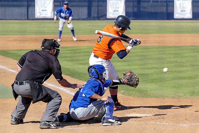 Cosumnes+River+College+freshman+catcher+Logan+Marston+checks+his+swing+against+Modesto+Junior+College+on+March+20.+The+CRC+Hawks+won+the+game+908+after+an+early+rally.