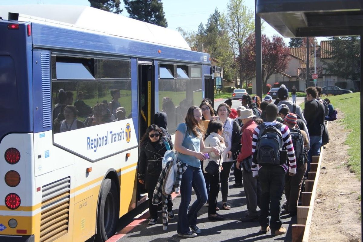 Students board a Regional Transit bus at the front of Cosumnes River College on March 11.  Riding public transportation helps students save money on rising gas prices.
