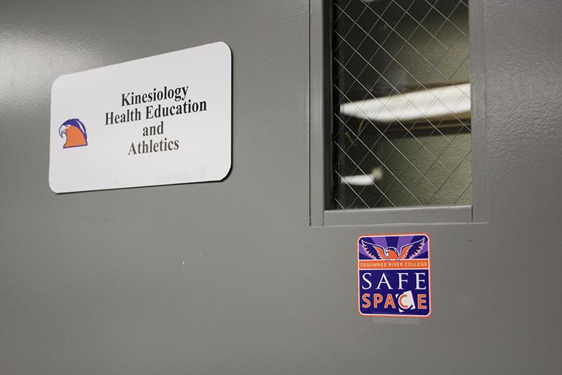 The door of the kinesiology, health education, and athletics department at Cosumnes River College bears the Safe Space sticker, showing that faculty and administration in this department are allies of the program. 