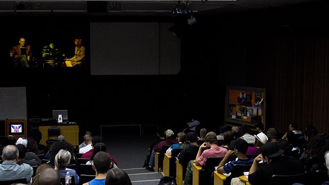 Students+watch+a+live+broadcast+of+author+and+Earth+Day+keynote+speaker+Michael+Pollans+discussion+moderated+by+Communications+Professor+Georgine+Hodgkinson+in+the+Library+Forum+on+April+24.+The+all-day+Earth+Day+events+topped-off+a+week+long+Earth+Day+celebration.