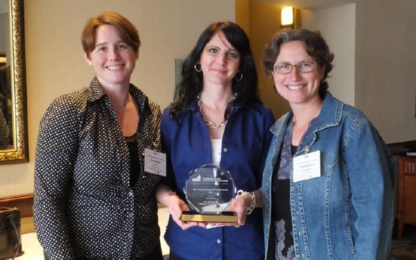 Anthropology professors (from left to right) Amanda Paskey, Shannon Mills and Anastasia Panagakos receiving the award for their work in campus diversity.