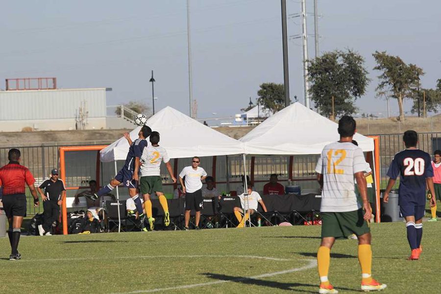 Sophomore defender for Canada Julian Alcala and Hawks freshman midfielder Steven Moreno both leap for the ball as it flys through the air.