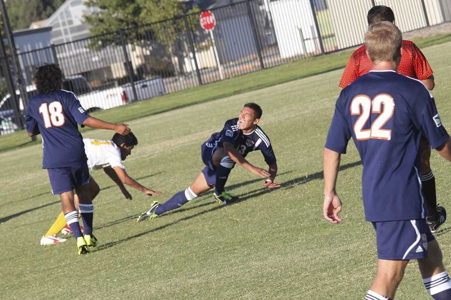 Steven Moreno, freshman midfielder for the Hawks, takes a fall during CRCs match with Canada college on Sept. 12.