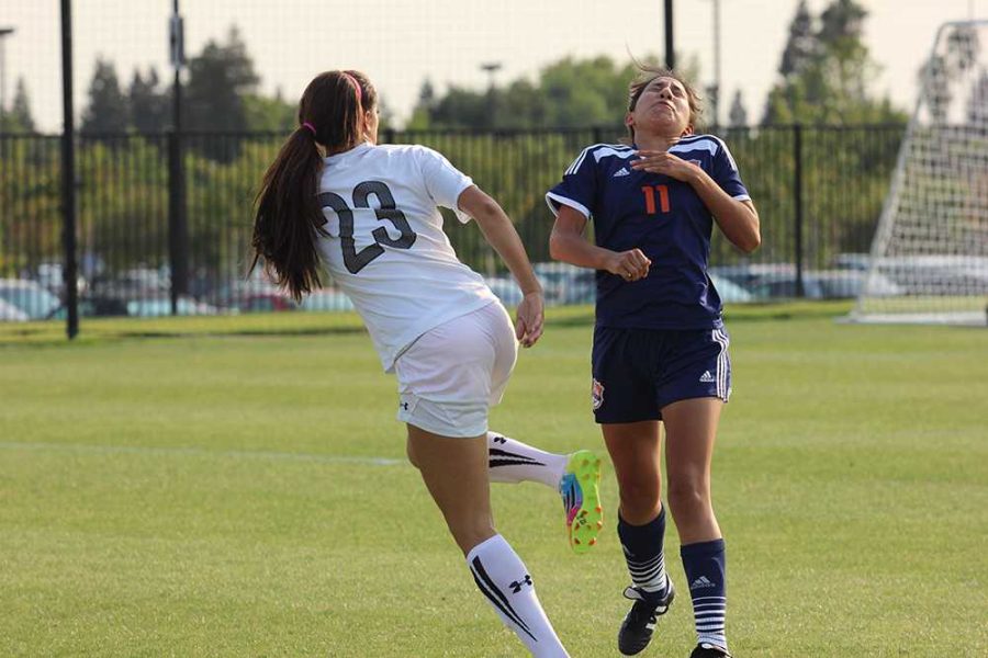 Rams freshman forward Kambria Morrison kicks the ball into the face of Hawks sophomore forward Selina Barbosa during the second half of the teams match on Sept. 9. 