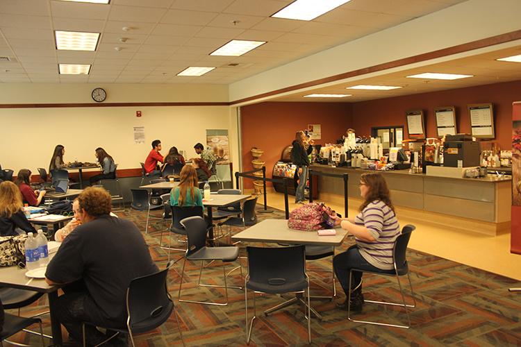 Students in the cafeteria enjoying food and friends near the Rio Bistro.