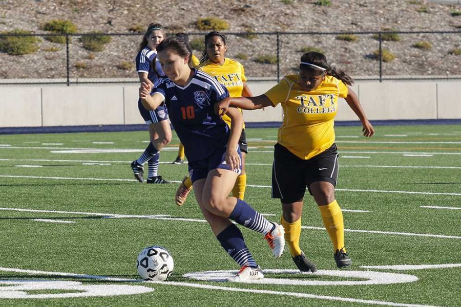 Hawks freshman defender Erica Lim avoids a Taft College player in order to try and maintain control of the ball on Nov. 22. Lim was credited with an assist for the first goal of the game by freshman midfielder Kate Burkhardt. 