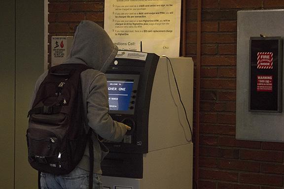 A student uses the Higher One ATM in CRC's library building. Some students have reported problems with the ATM working correctly.