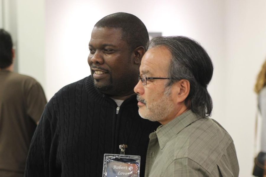 Illustrator and former student Robert Love (left) was one of the four artists contacted by art Professor Yoshio Taylor (right) to take part in the third show at CRC's Art Gallery opening on March 6.