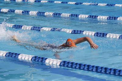 Freshman swimmer Megan Lapomardo competing in the 100 meter freestyle at the Big 8 Invitational at America River College on March 13.