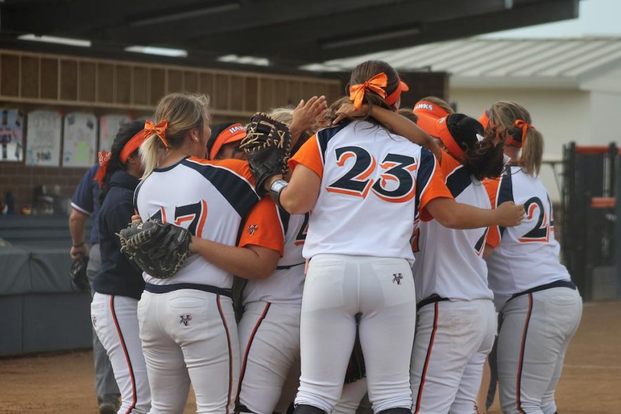 The softball team celebrating after defeating DVC 6-2 during their Big 8 Conference.