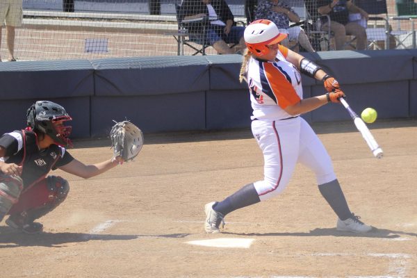 Raechel Hooper, freshman catcher and first baseman bunting the ball at their May 2 playoff game against the Fresno City Rams.