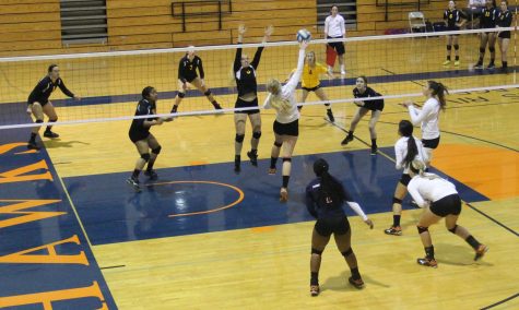 Justice Cooper, outside hitter, goes for a spike on the ball during a tournament hosted at CRC on Sept. 18.