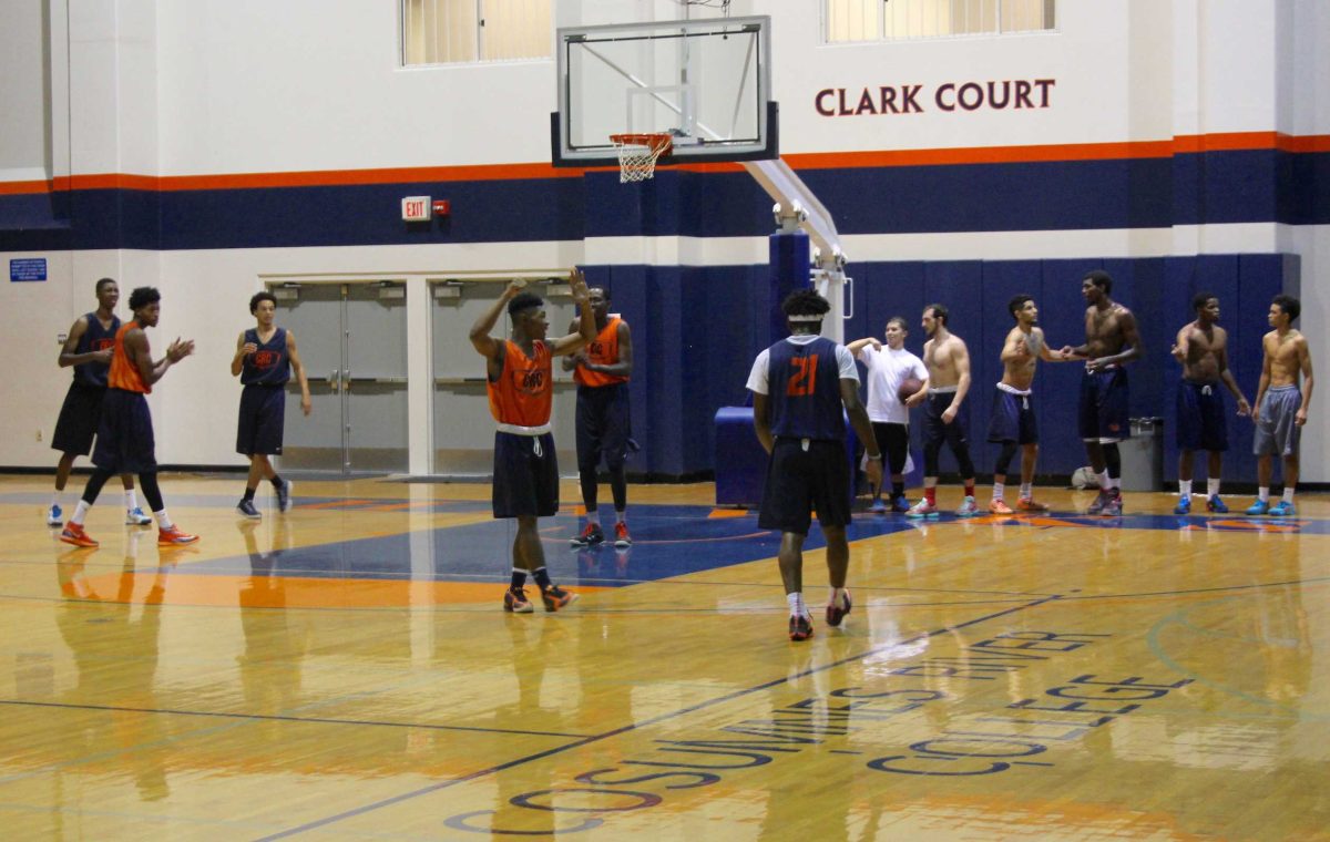Men's basketball team practicing in preparation for upcoming season