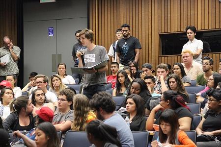 Students take part in question-and-answer forum after presidential debate viewing in L-111 on Monday.