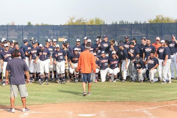 Head coach Tony Bloomfield speaks to Cosumnes River College baseball players and alumni following the current team’s 2-0 victory in a friendly scrimmage against alumni of the CRC baseball program last fall.
