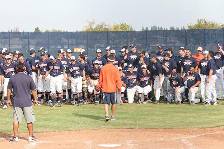 Head+coach+Tony+Bloomfield+speaks+to+Cosumnes+River+College+baseball+players+and+alumni+following+the+current+team%E2%80%99s+2-0+victory+in+a+friendly+scrimmage+against+alumni+of+the+CRC+baseball+program+last+fall.%0A