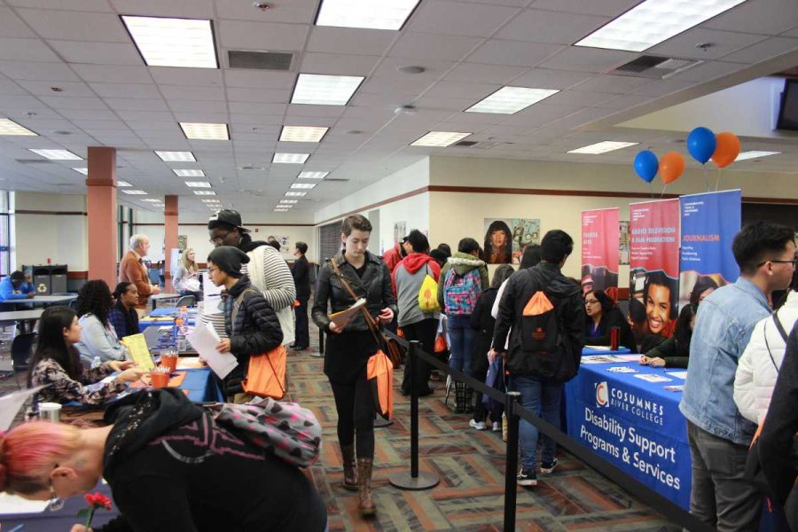 New students visit the cafeteria to obtain information on various student services, like financial aid and the campus tutoring lab.