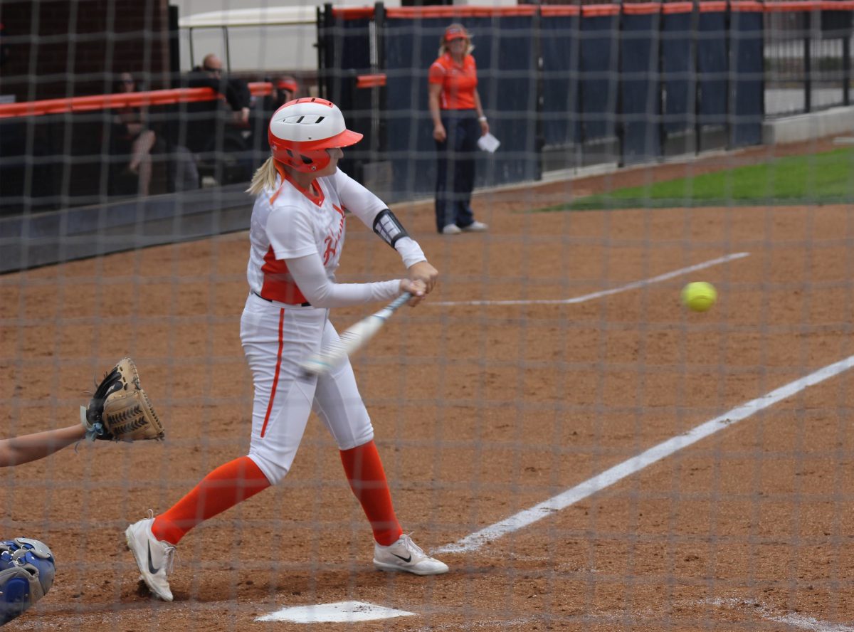 Sophomore left fielder Lindsay Lambert hits in a close game against Modesto College