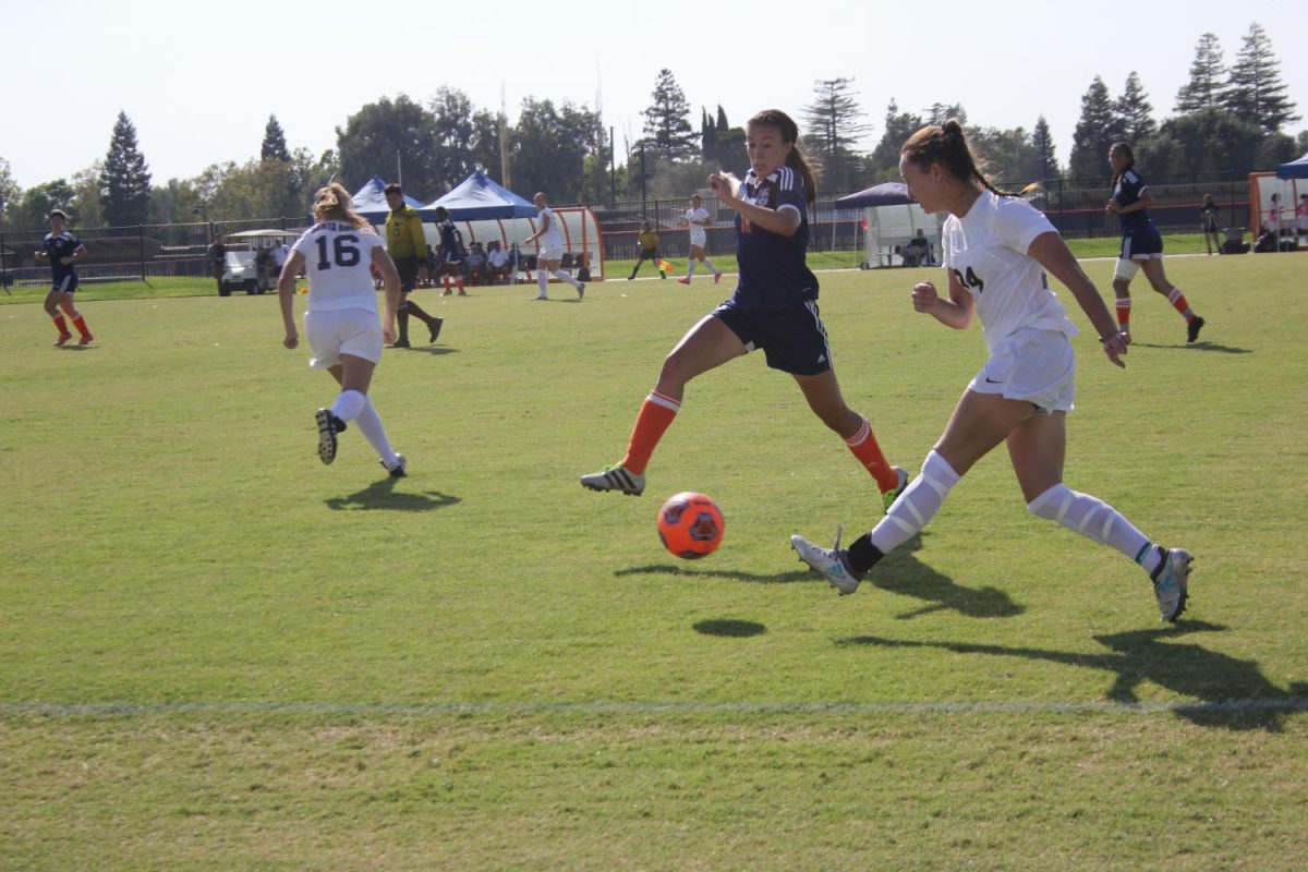 Sophomore defender Amanda Lopez fights for the ball in the Hawks' game against Santa Rosa on Sept. 15.