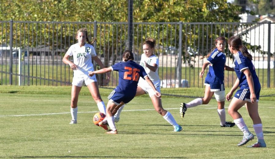 Freshman player Renata Montanez tries to maintain control of the ball in the Hawks game against the Diablo Valley Vikings on Friday.