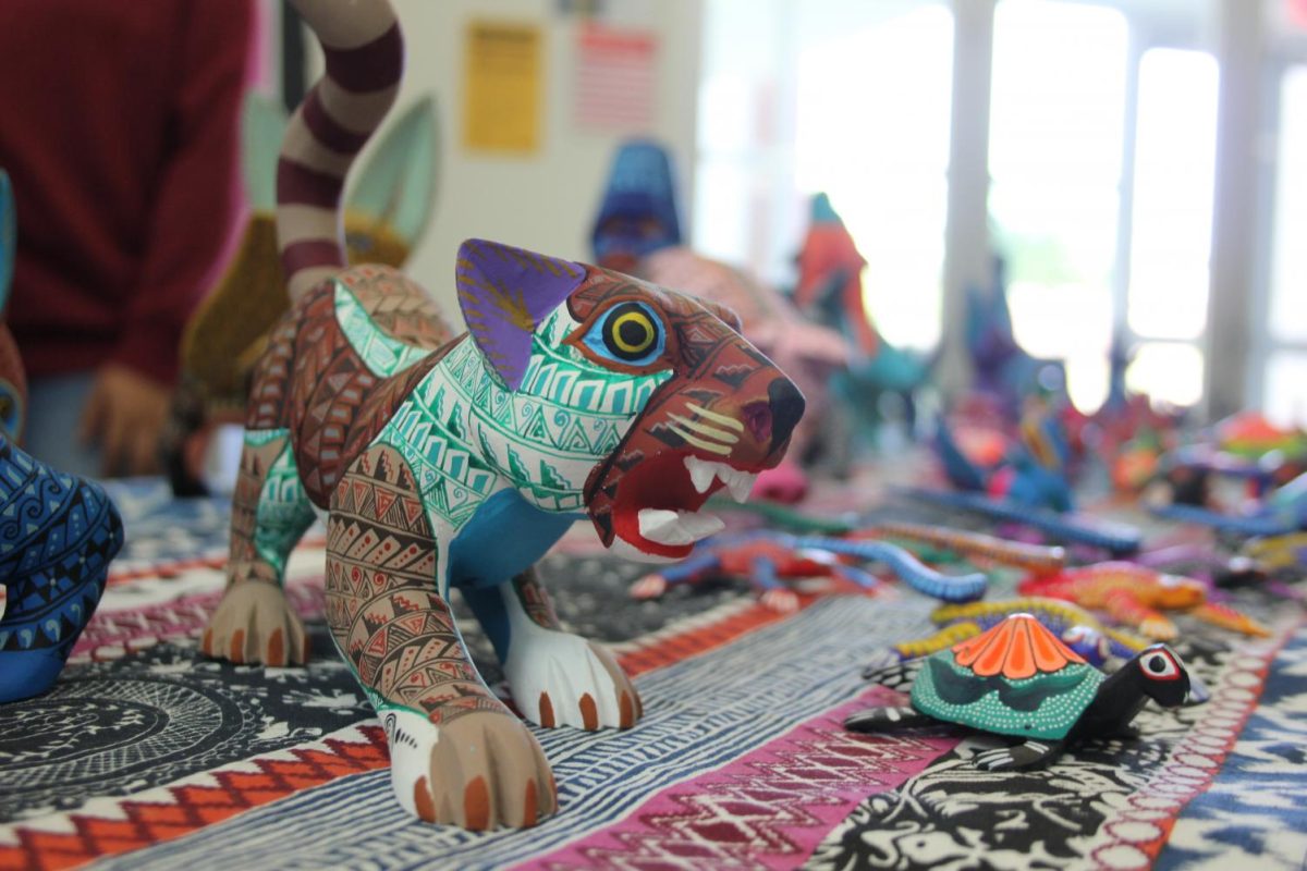 Carvings painted by Oaxacan artist Alma Arreola on display for view and potential sale on Oct. 10. Arreola's work is part of an artists' collective called Ecoalebrijes.