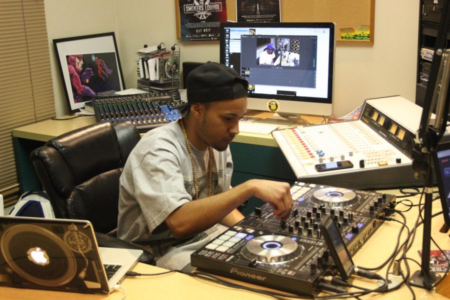 Cole McCarthy, also known as DJ Rus Ruthless, hosts The 360 Radio show in the studio in Old Sacramento on Oct. 4.
