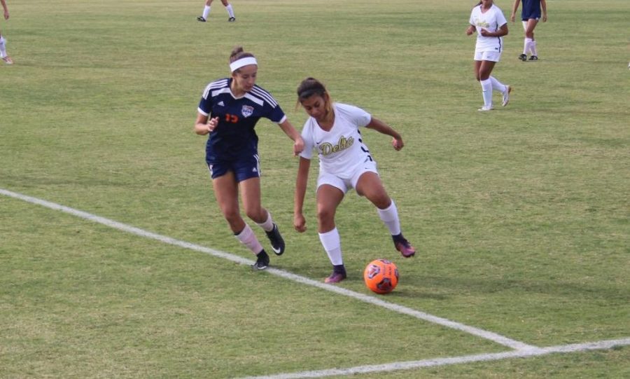 Hawks+sophomore+player+Gabriella+Bernard+fights+for+the+ball+along+the+sidelines+in+the+game+against+San+Joaquin+Delta+on+Friday.