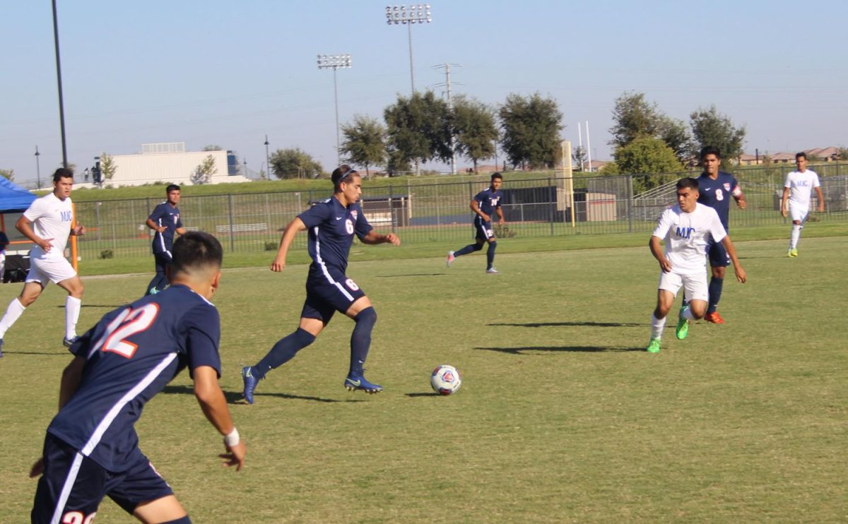 Freshman midfielder Lincoln Carvalho leads the drive in Friday's game against Modesto Junior College.