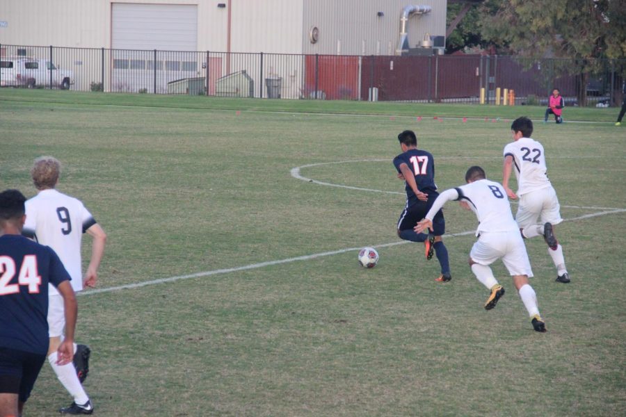 Sophomore midfielder and forward Enzo Leon pushes to create a drive in the Hawks tie game against Folsom Lake on Nov. 10.