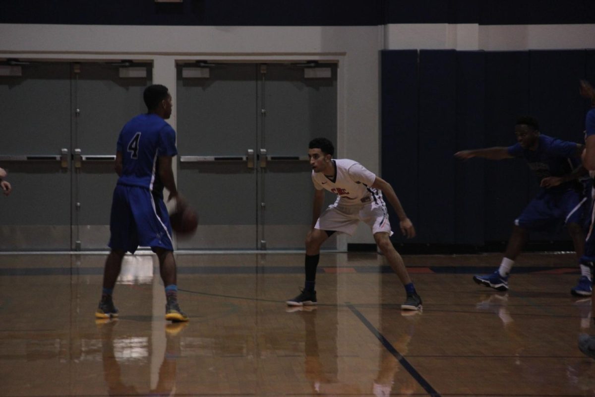 Hawks guard Onkar Sidhu playing defense against the Modesto Pirates