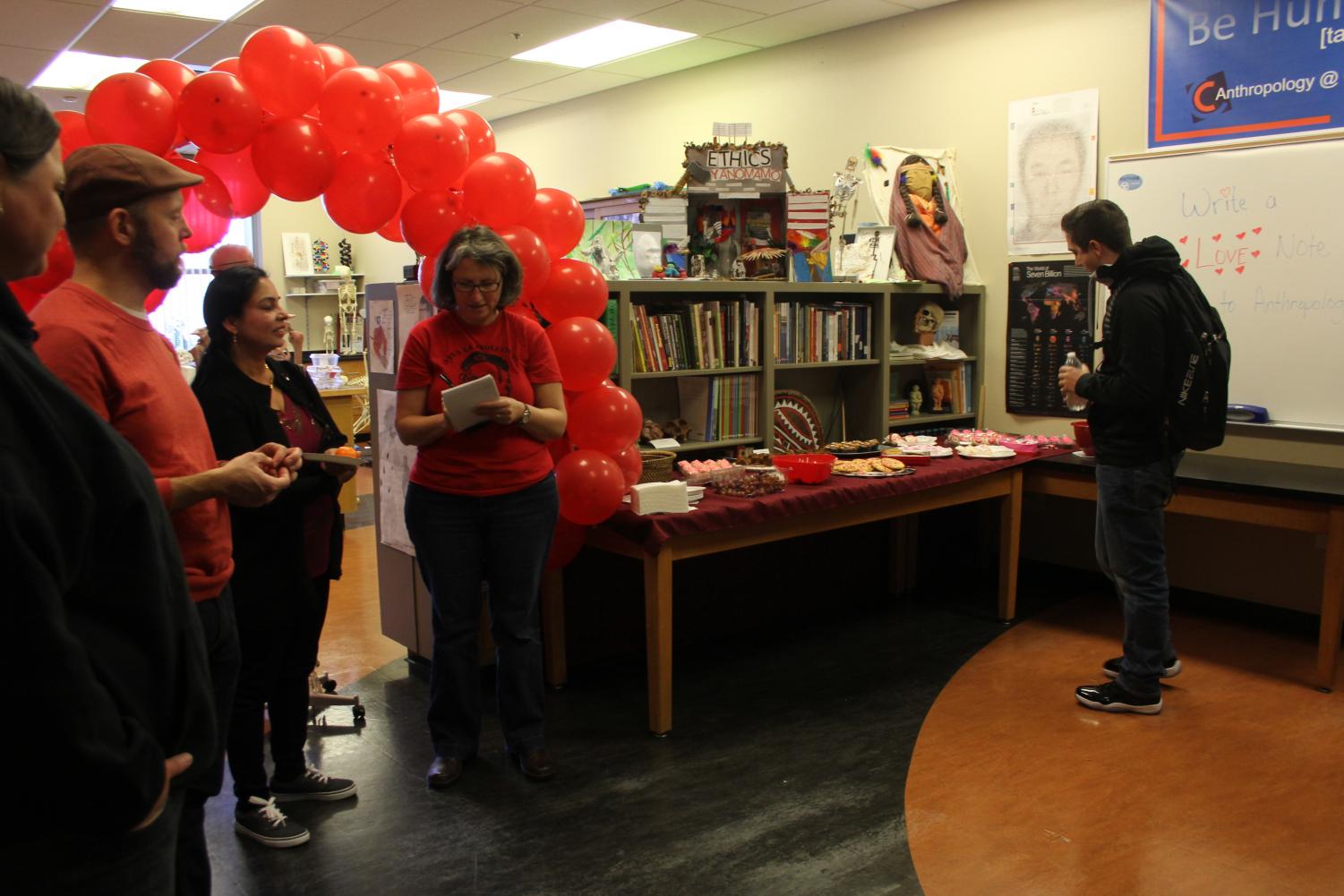 In room LRC-103 Anthropology professor Anastasia Panagakos, middle, is writing her love note for the event on Feb. 14. for