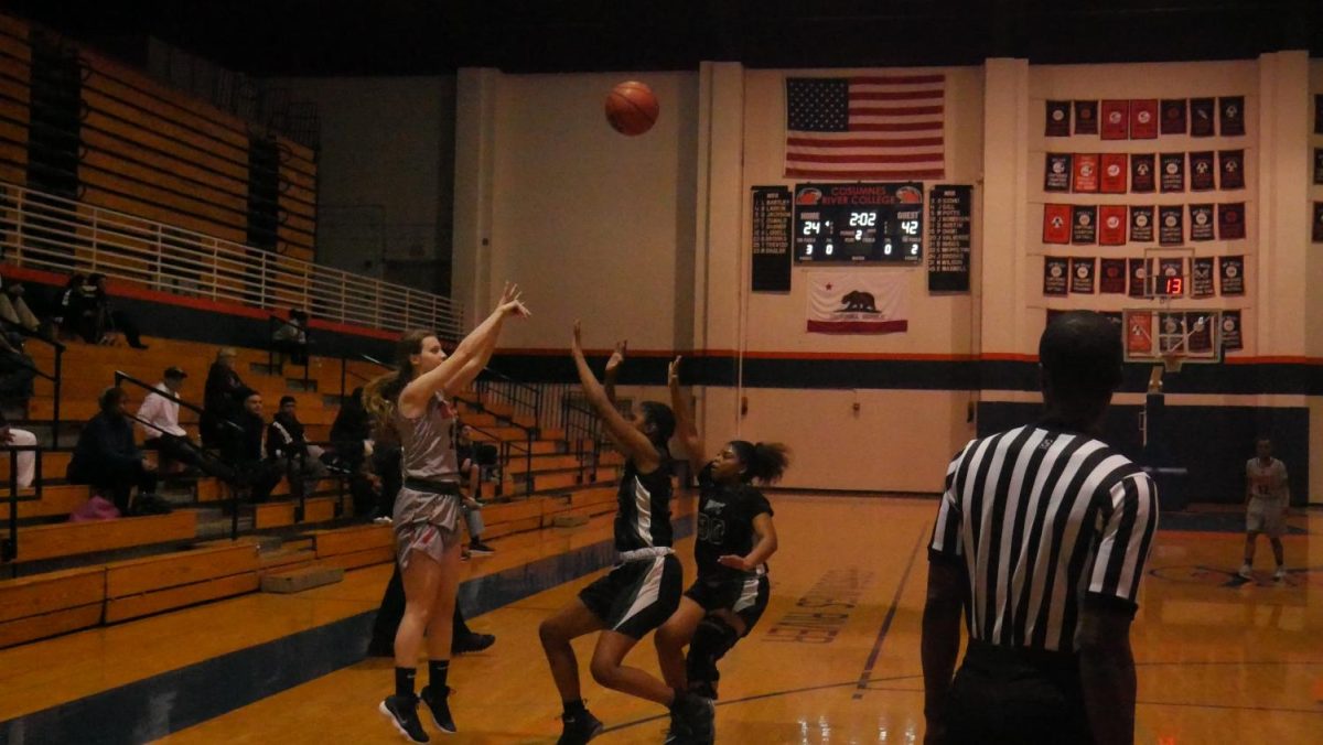 Guard Trina Shaner shooting a three in a loss to the DVC Vikings 