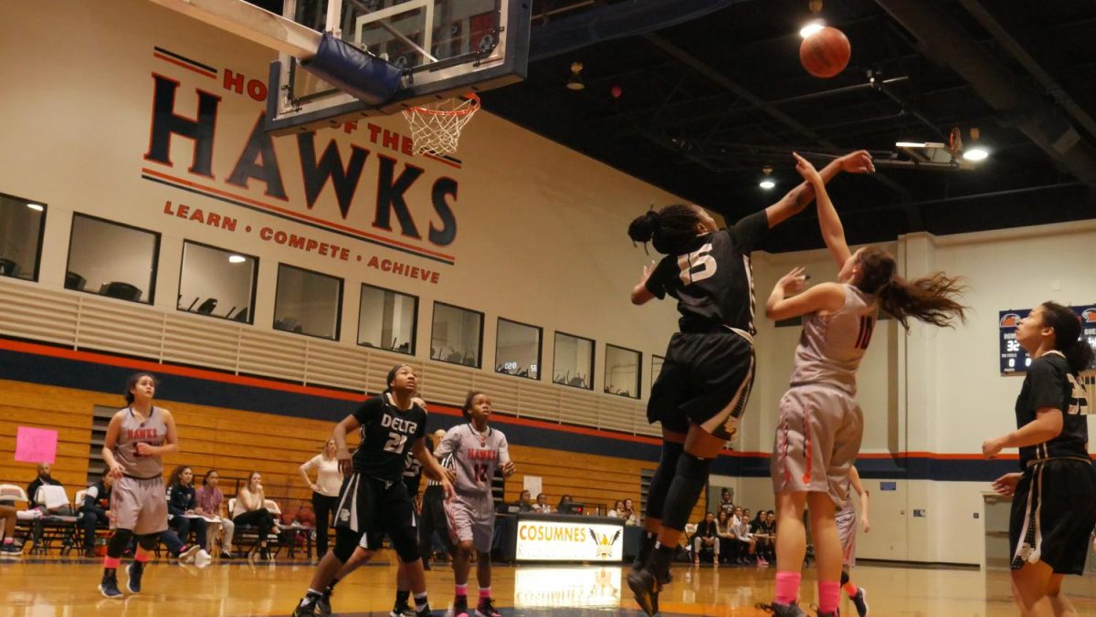 Guard Erica Oswald going up for a shot in a 48 point loss against Delta College