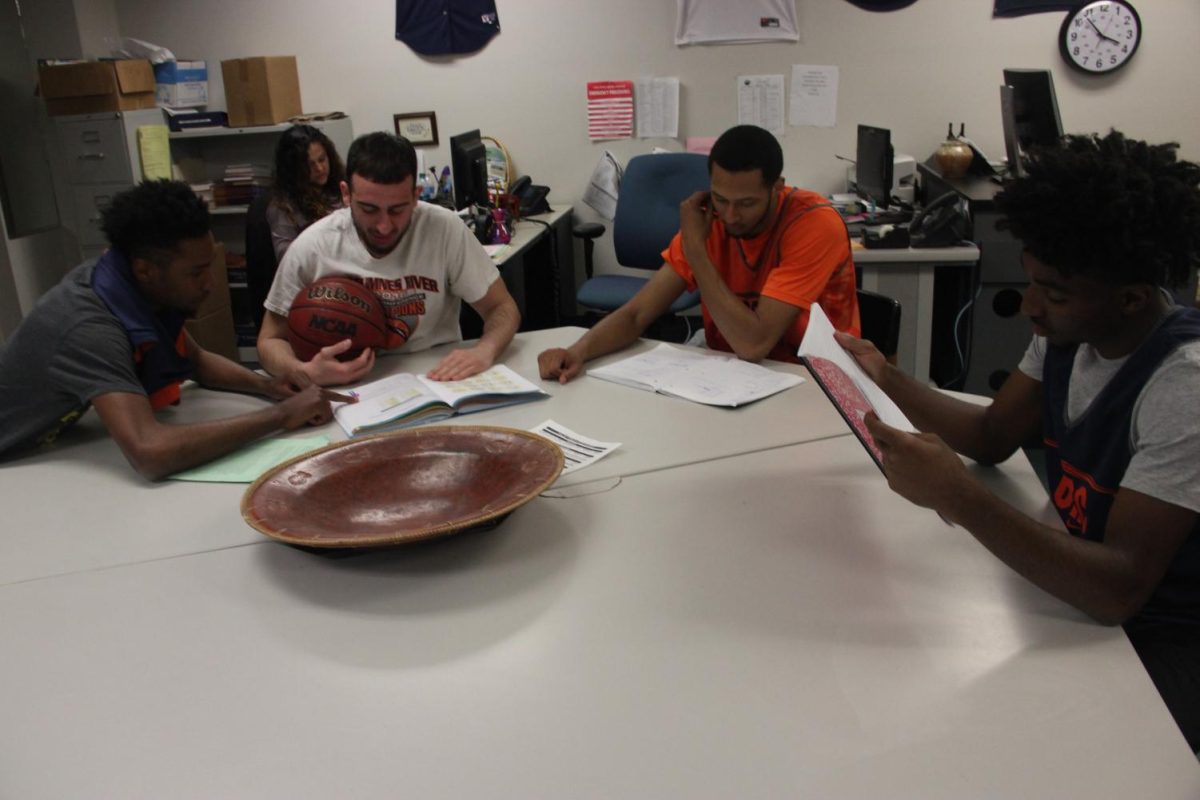 Members of the mens basketball team putting in time in the study hall in CAC 104 to keep their grades up so they can stay on the court.