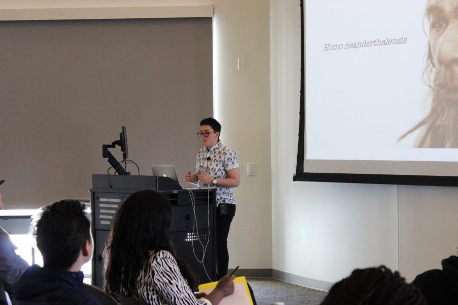 Dr. Anna Goldfield explains her PowerPoint slides to the audience in WINN 150.